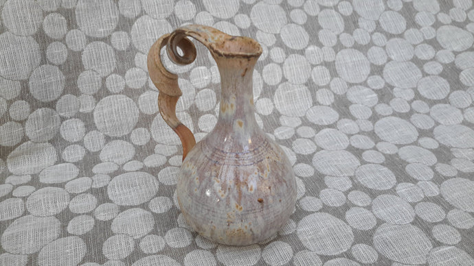 Decorative stoneware wheel thrown bottle